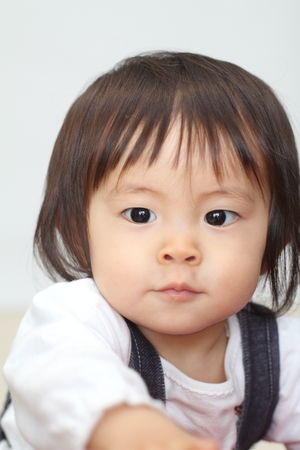 Smiling Japanese baby girl (1 year old)の写真素材