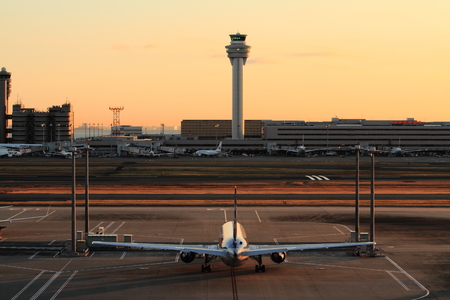 Airplane parking at Tokyo international airport (at dawn)のeditorial素材
