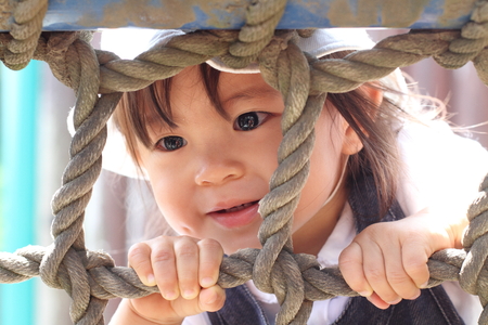Japanese girl playing at field athletic (1 year old)の写真素材