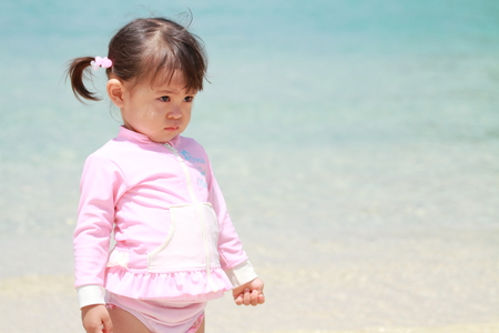 Japanese girl on the beach (1 year old)の写真素材