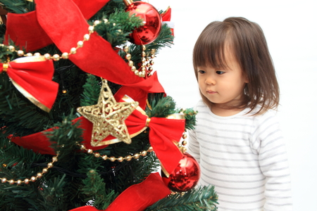 Christmas tree and Japanese girl (2 years old)の写真素材