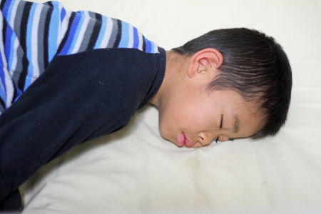 Sleeping Japanese boy (first grade at elementary school)の写真素材