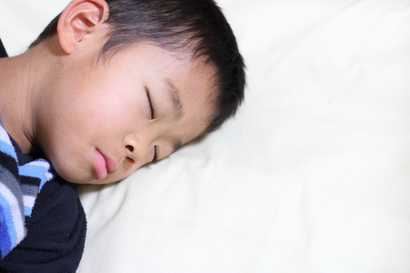 Sleeping Japanese boy (first grade at elementary school)の写真素材