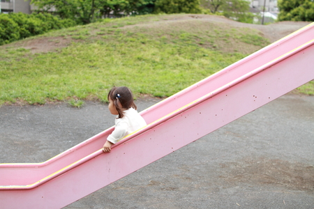 Japanese girl on the slide (2 years old)の写真素材