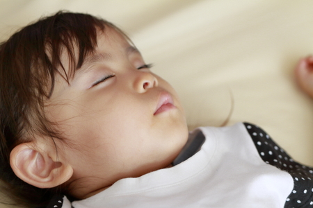 sleeping Japanese girl (2 years old)の写真素材
