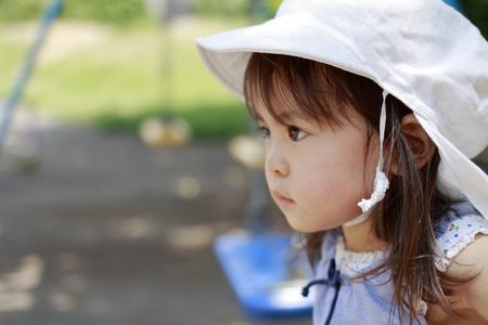 Japanese girl on the swing (2 years old)の写真素材