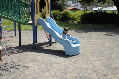 Japanese girl on the slide (2 years old)の写真素材