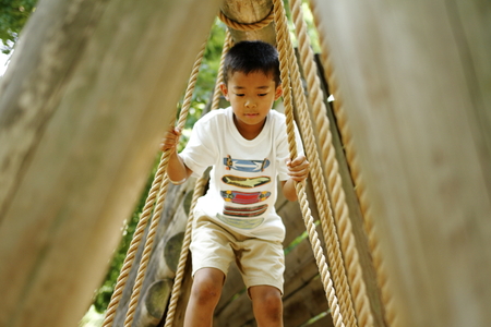 Japanese boy playing with ropewalking (second grade at elementary school)の写真素材
