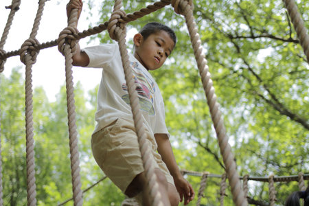 Japanese boy playing with ropewalking (second grade at elementary school)の写真素材