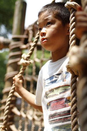 Japanese boy playing with ropewalking (second grade at elementary school)の写真素材