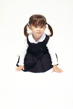 Japanese girl on the floor in formal wear (2 years old)の写真素材