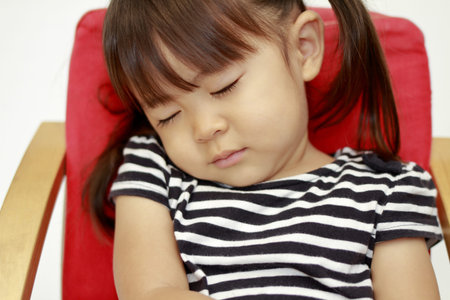 Japanese girl sleeping on chair (2 years old)