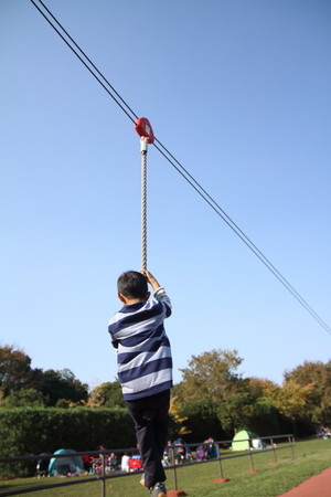 Japanese boy playing with flying fox (second grade at elementary school)の写真素材