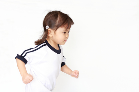 Running Japanese girl in sportswear (3 years old)の写真素材