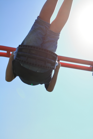 Japanese boy on the swing (third grade at elementary school)の写真素材