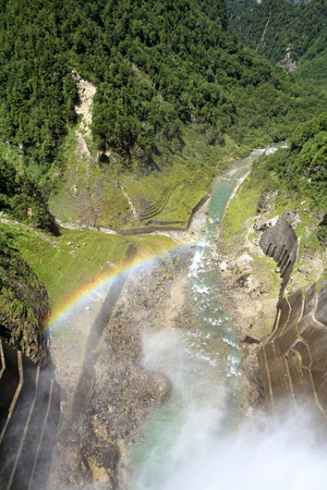 discharge from Kurobe dam with rainbow in Toyama, Japanの写真素材