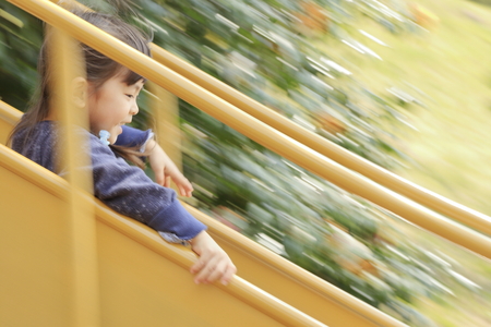 Japanese girl on the slide (4 years old)の写真素材