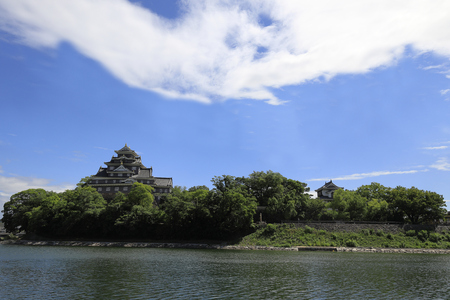 castle keep of Okayama castle and Asahi river in Okayama, Japanのeditorial素材