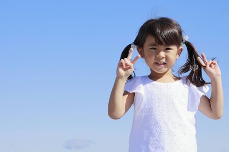 Japanese girl under the blue sky (4 years old)の写真素材