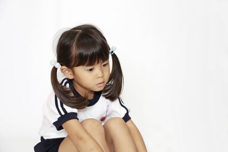 sitting Japanese girl in sportswear (4 years old) (white back)の写真素材