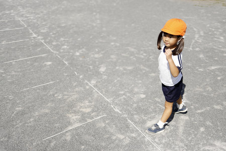running Japanese girl in sportswear (4 years old)