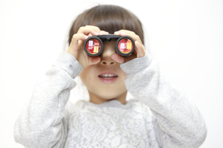 Japanese girl with opera glass (white back) (5 years old)の写真素材