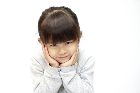 smiling Japanese girl (5 years old) (white back)の写真素材