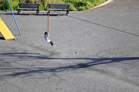 Japanese girl (5 years old) playing with flying foxの写真素材