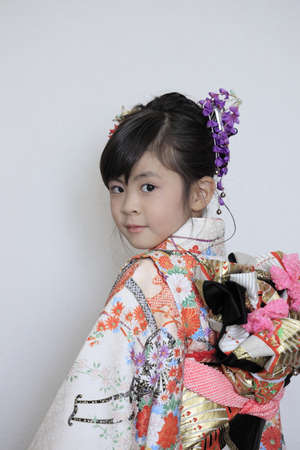 Japanese girl on Seven-Five-Three festival (white back) (7 years old)の写真素材
