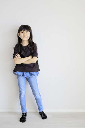Japanese girl folding her arms (7 years old)の写真素材