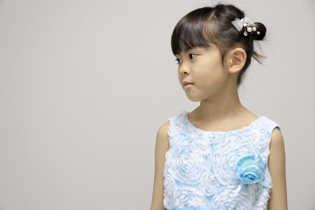 Japanese girl in a dress (profile) (7 years old)の写真素材
