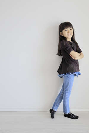 Japanese girl folding her arms (7 years old)の写真素材