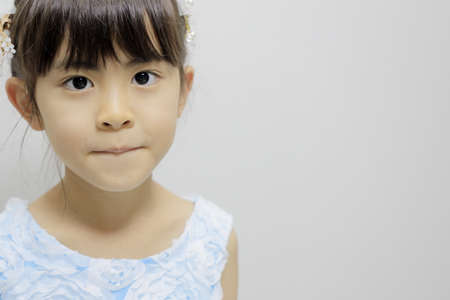 Japanese girl in a dress (7 years old)の写真素材