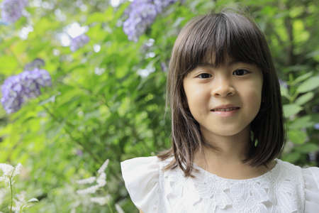 Japanese girl and hydrangea (7 years old) (purple)の写真素材