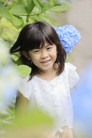 Japanese girl and hydrangea (7 years old) (blue)の写真素材