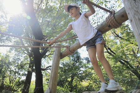 Japanese student girl playing with rope walking (7 years old)の写真素材