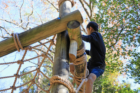 Japanese junior high school student playing with rope walking (13 years old)の写真素材
