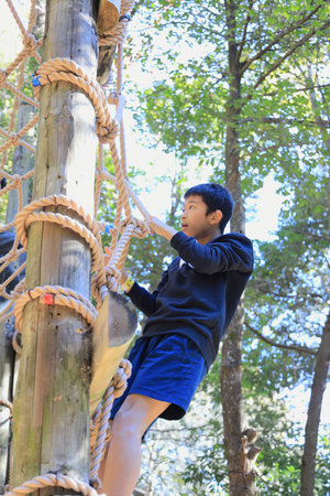 Japanese junior high school student playing with rope walking (13 years old)の写真素材