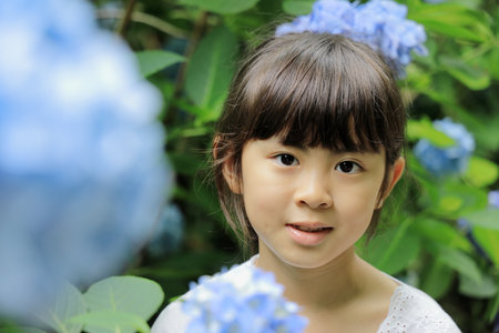 Japanese girl and hydrangea (8 years old) (blue)の写真素材