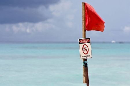 red flag indicating danger on the water in the tropicsの写真素材