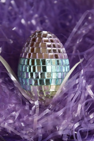 Easter disco egg on strawの写真素材