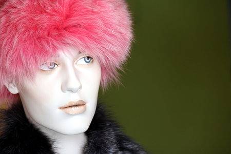 pink fur hat on mannequin's headの写真素材