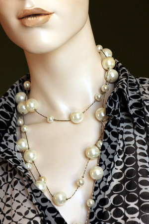 pearl necklace and patterned shirt on female mannequinの写真素材