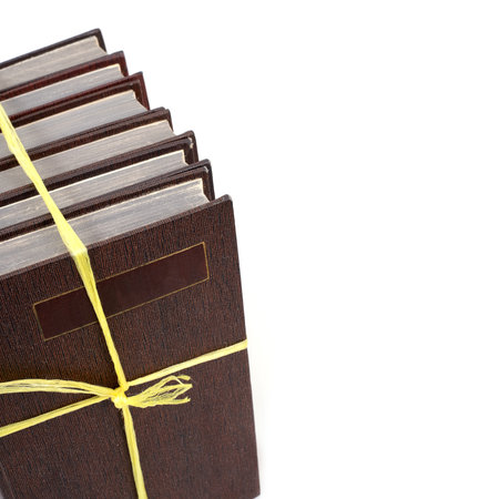 Stack of books in color covers with white sheets isolated on a white background