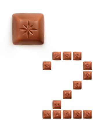 Numeral figures from pieces of chocolate isolated on white background
