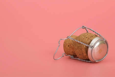 Champagne and wine cork isolated on pink backgroundの写真素材