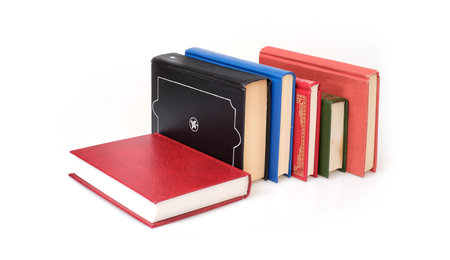 Stack of books in color covers with white sheets isolated on a white background