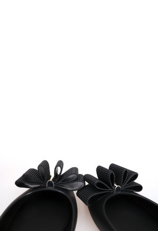 Comfortable beautiful low-heeled black shoes isolated on white background