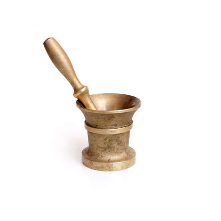 Heavy bronze mortar with pestle for grinding food spices and medicine isolated on white backgroundの写真素材