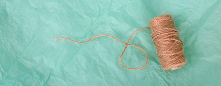 Concept poster, banner, greeting card with cord isolated on turquoise background